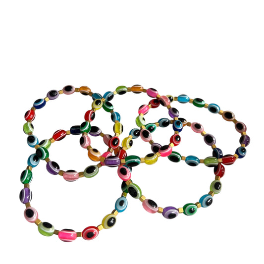 Vibrant friendship bracelet stack with beaded details
