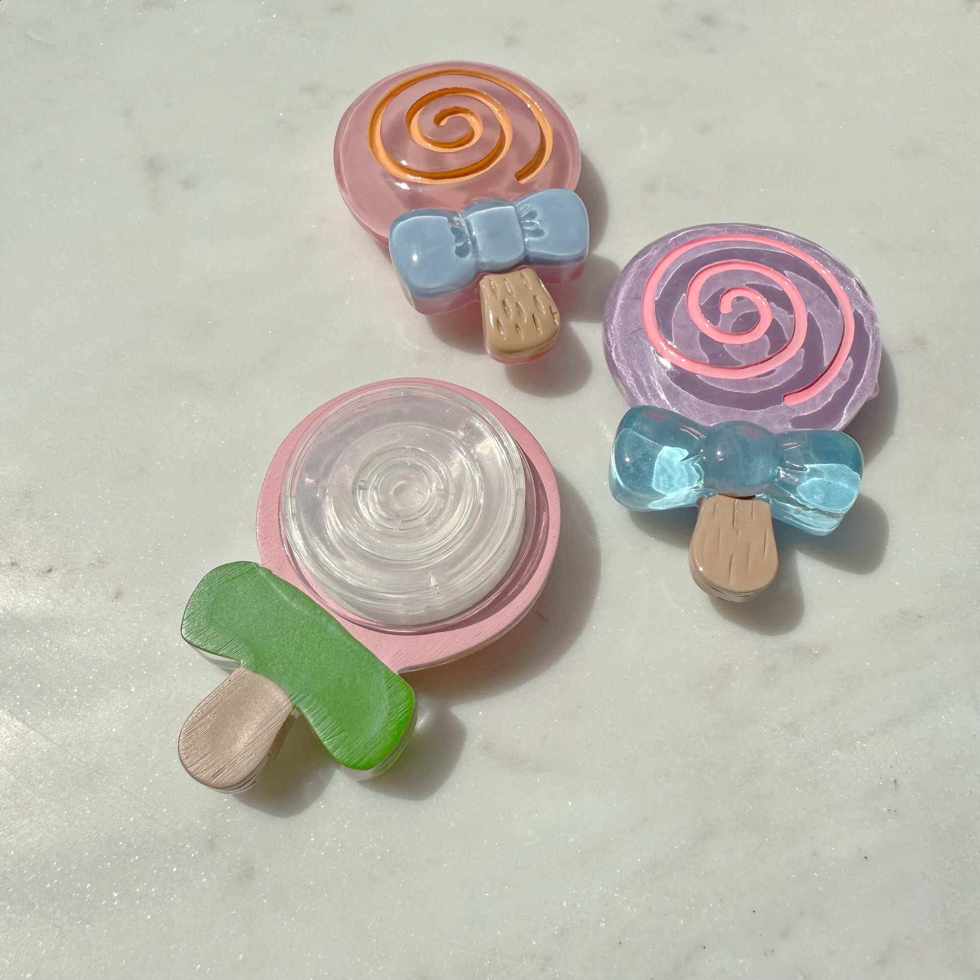 "My Boy Lollipop Pop Socket in pink from behind 