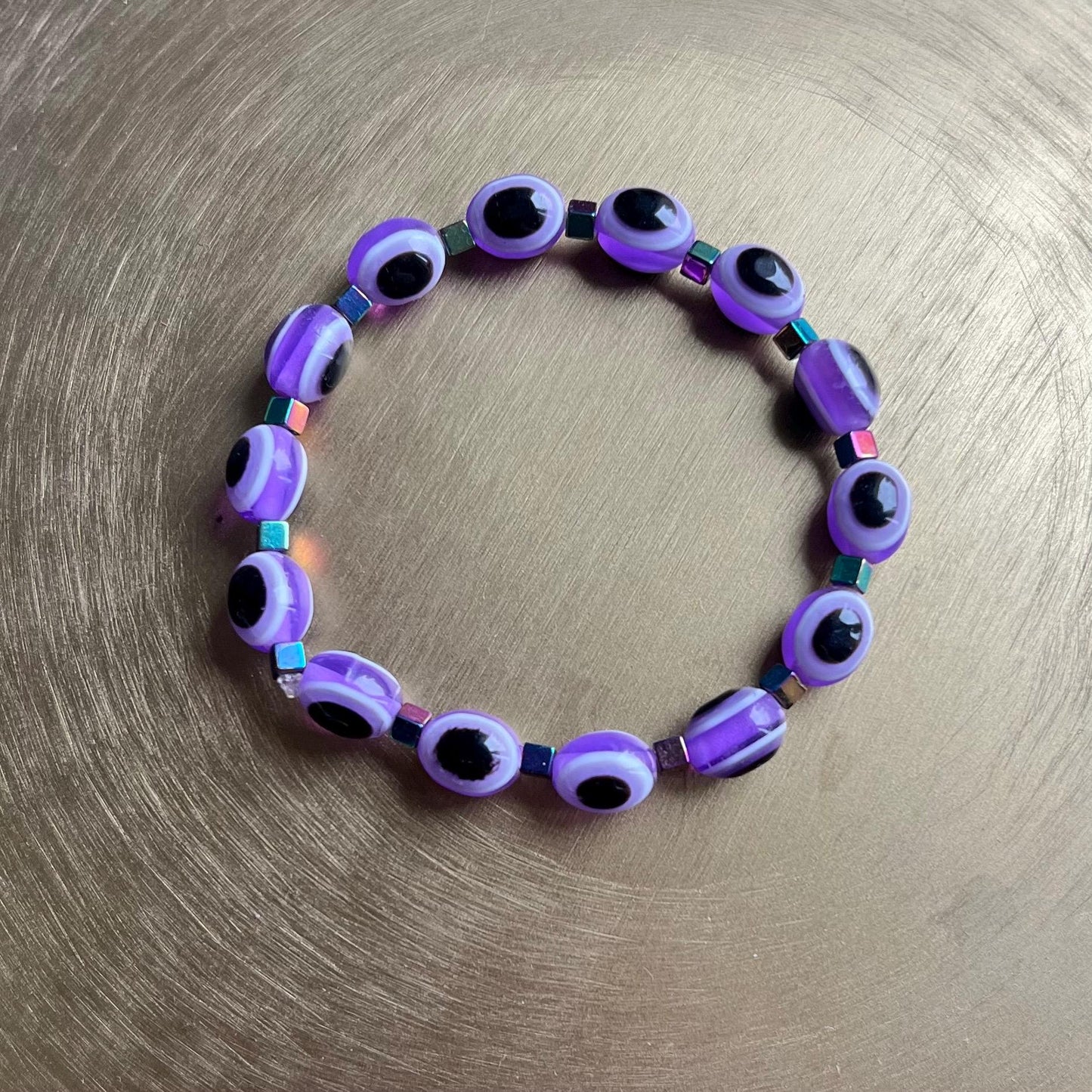 Purple evil eye protection bracelet with gemstones - Eclipse design"
