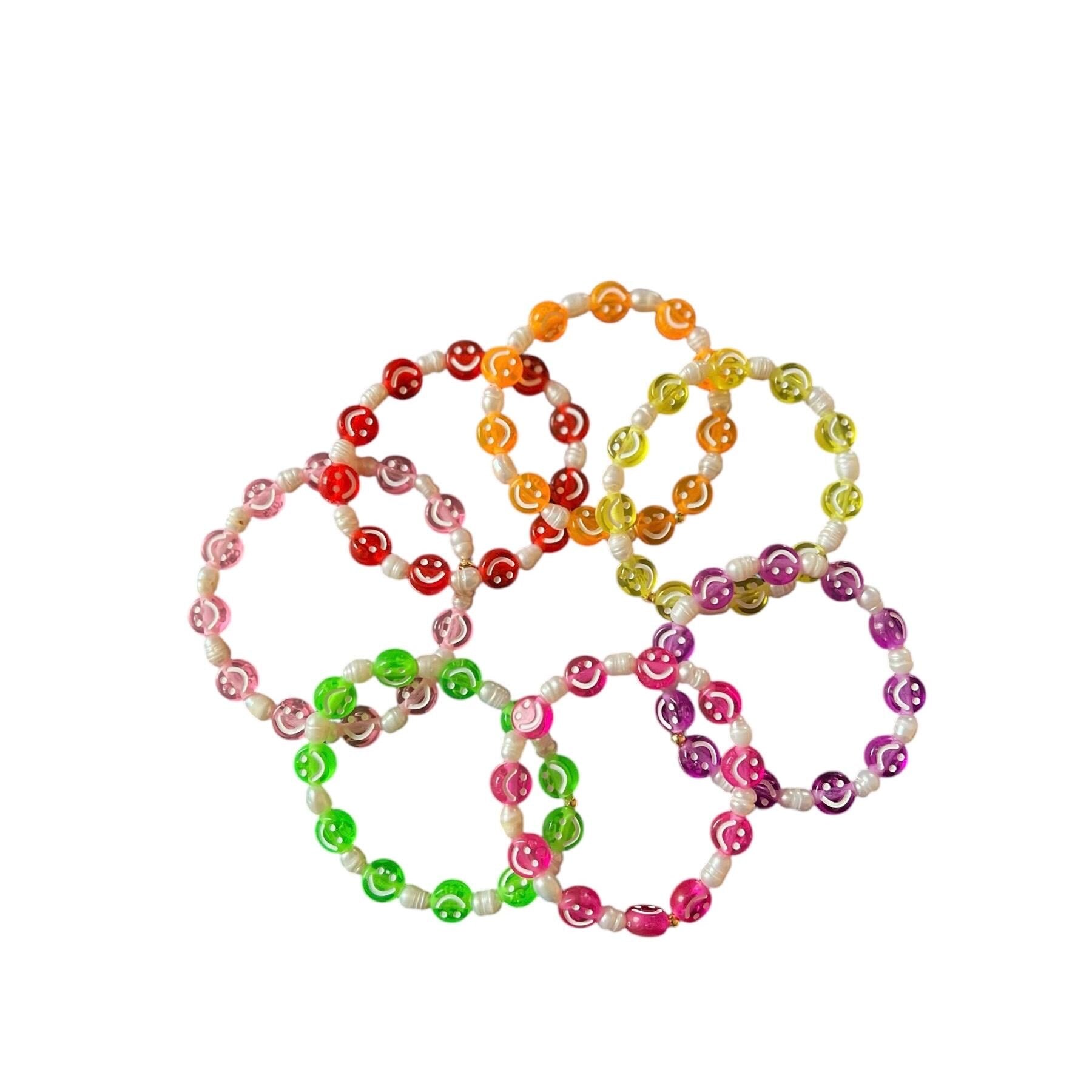 Rainbow elastic Happy Go Lucky bracelets with gold charm accents