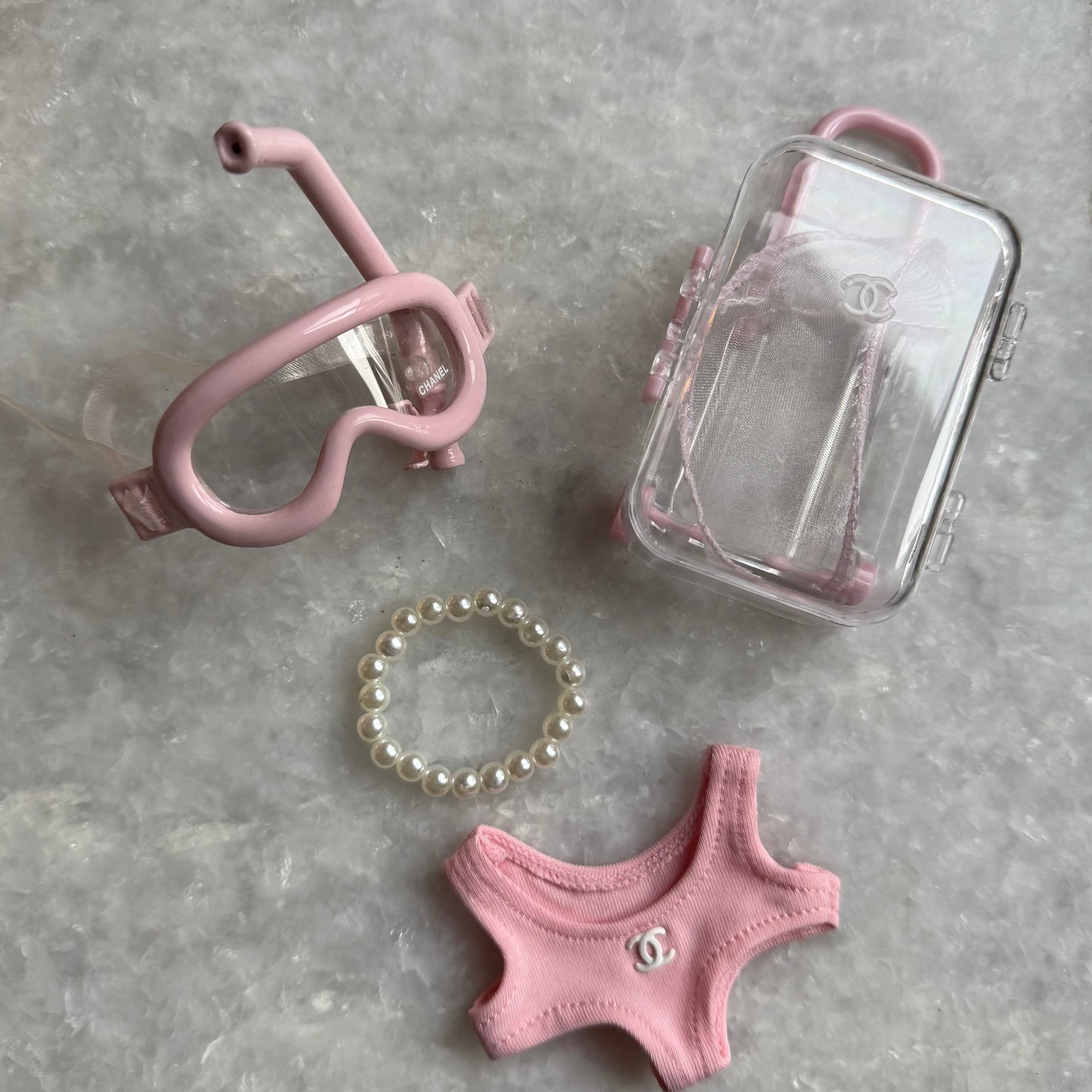 Labubu beach accessories set including clear travel case