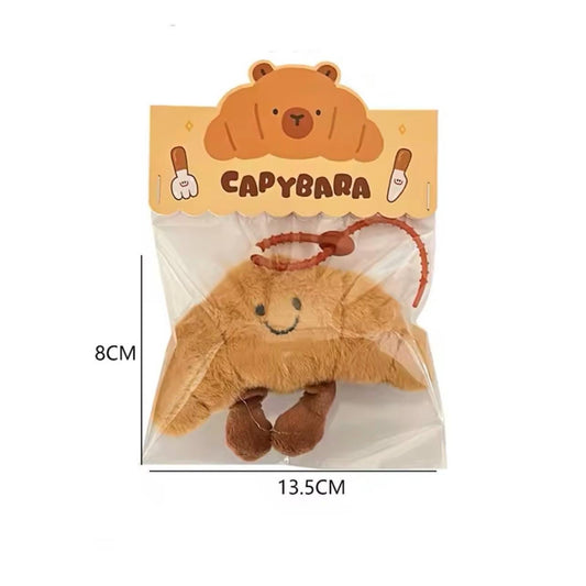 Kawaii capybara croissant plush charm - perfect bag accessory