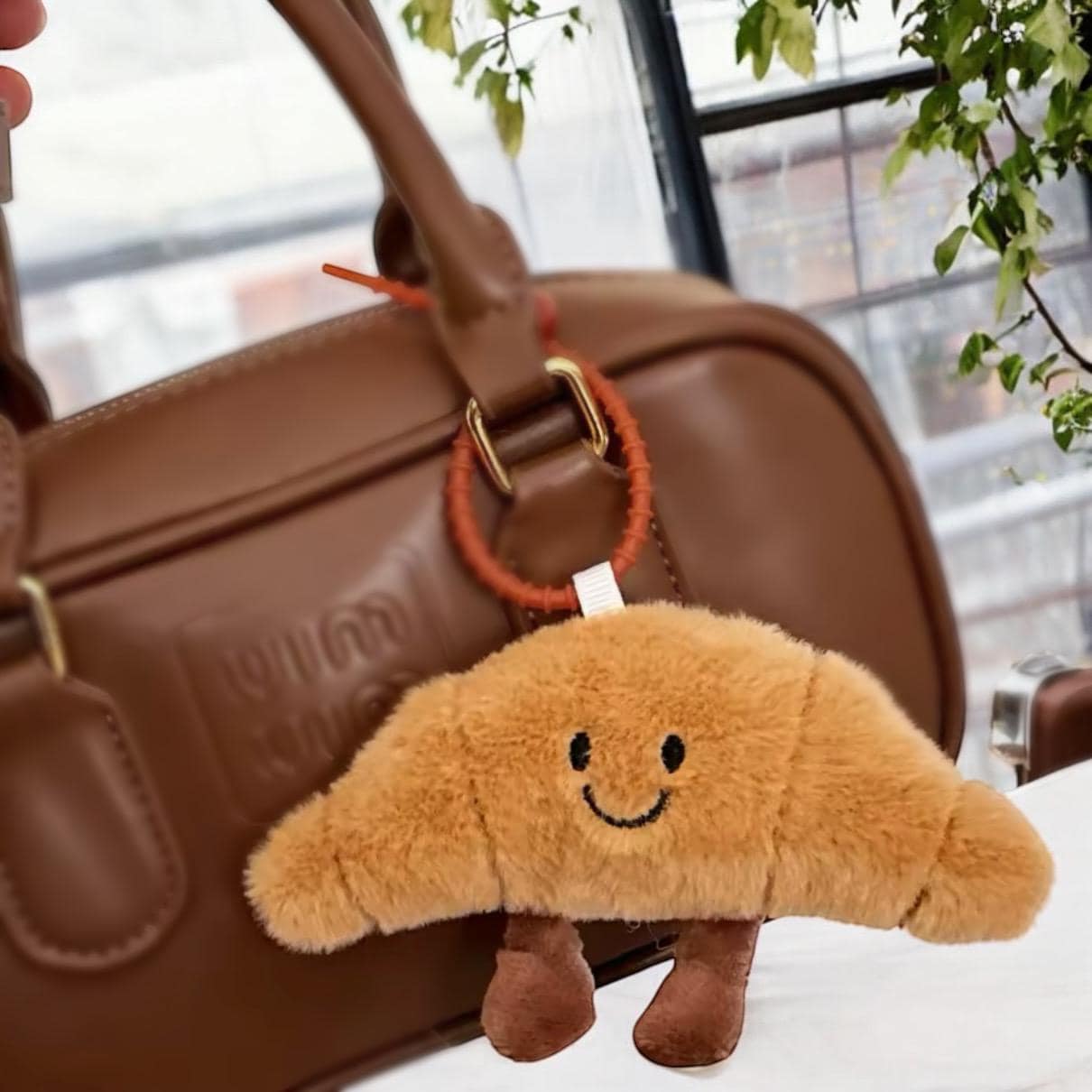 Cute capybara croissant bag charm - soft fluffy keychain accessory